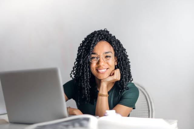 Smiling woman looking forward to parenthood